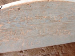 Origin of history of milling thesis carving in Frech Burr millstone wood casing at Yates Mill