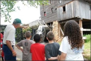 Yates Mill tour guide leading children's tour